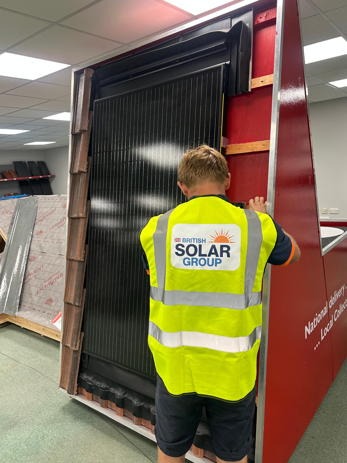 British Solar Group team member working with a full solar panel system