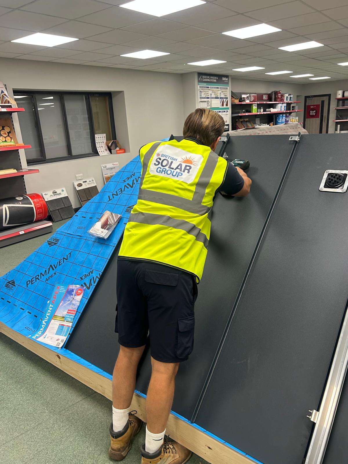 British Solar Group team member fitting solar mounting brackets