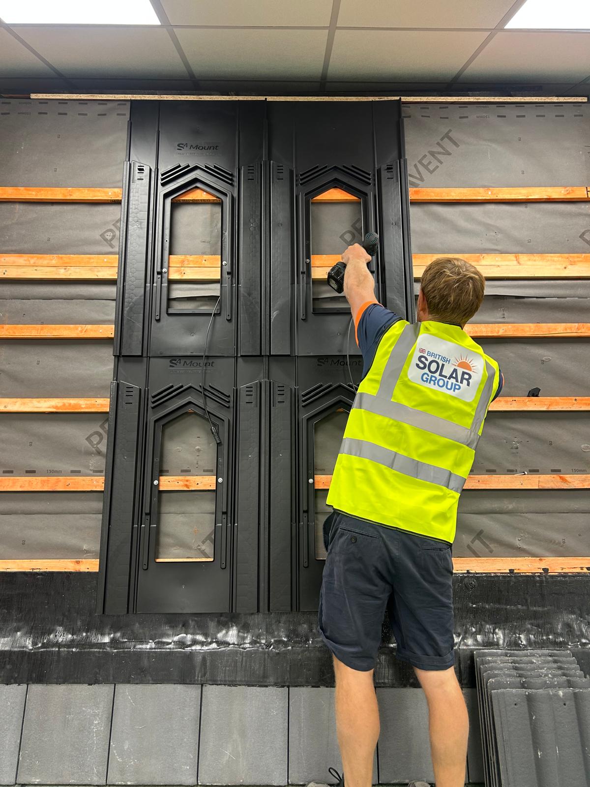 British Solar Group team member installing roof flashing